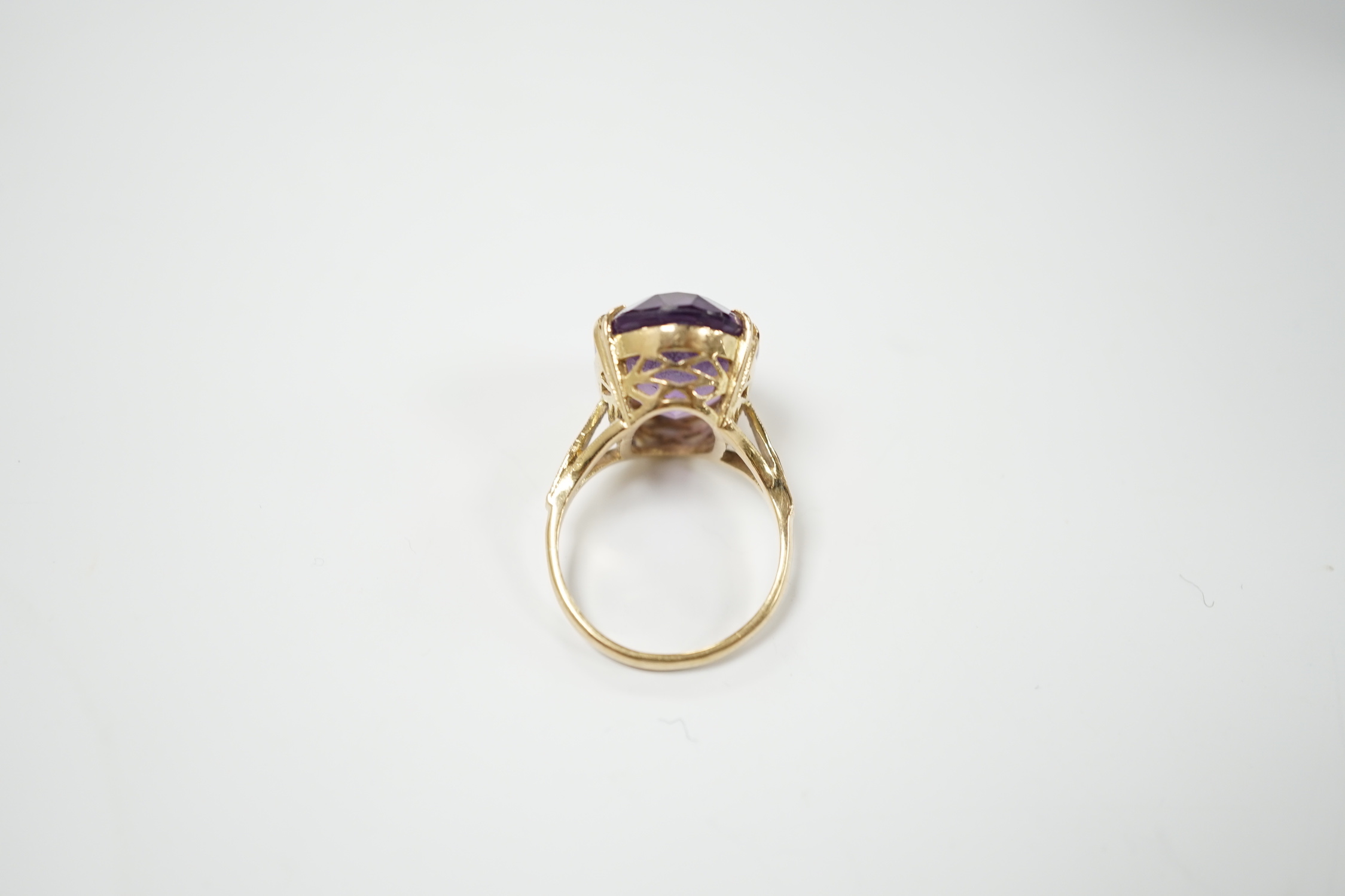 A modern 9ct gold and oval cut amethyst set dress ring, size M, gross weight 5.9 grams.